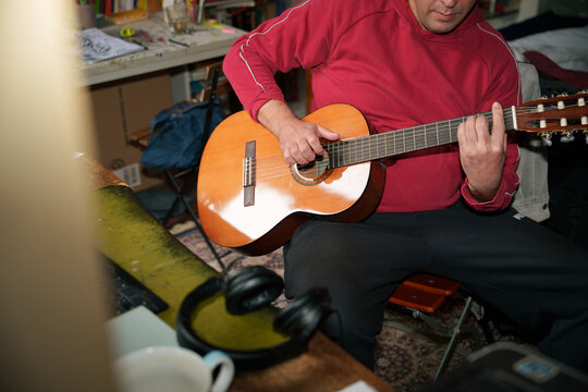 Person Playing Guitar