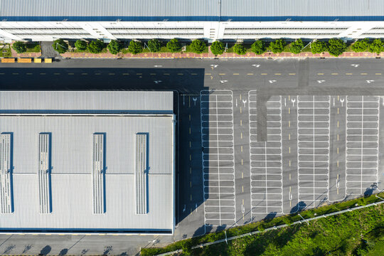Aerial view of industrial buildings and empty parking lot