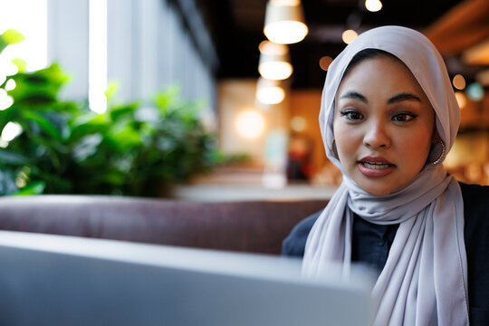 Woman in hijab speaking during video call