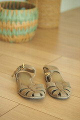 Comfortable sandals on a wooden floor in a cozy space