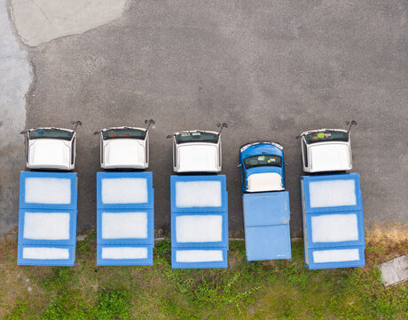 Aerial View of Blue and White Trucks Parked in a Row
