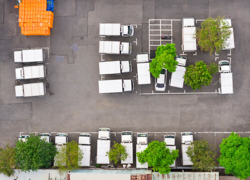 Aerial View Urban Parking Lot with Trees and Vehicles