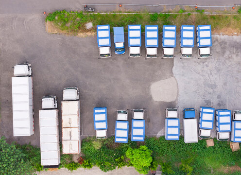 Aerial Parking Lot Orderly Blue White Trucks Green Border