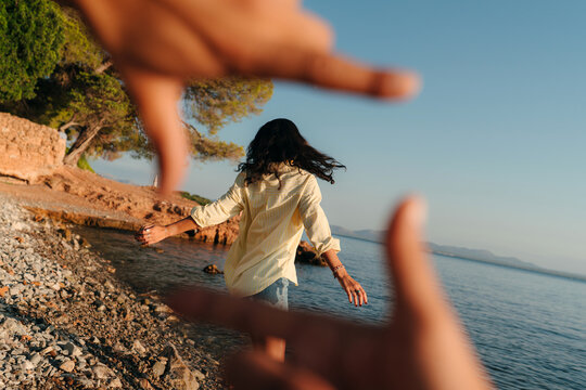 Young woman dancing at the beach portrait