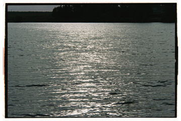 Sunlight reflecting on calm water during evening hours