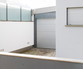 Modern Gray Sectional Garage Door White House Exterior