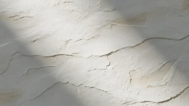 Elegant textured plaster wall with soft shadows creates a contemporary minimalist backdrop for modern interior design projects