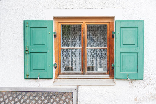 Rustic Wood Window with Open Green Shutters - Powered by Adobe
