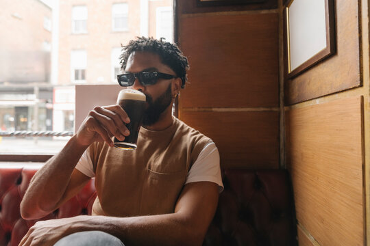 Enjoying a Cold Drink in a Dublin Pub on a Summer Day