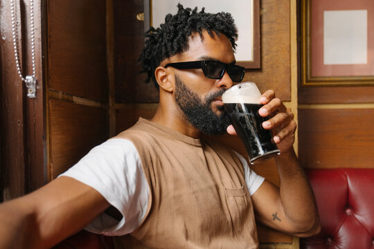 Enjoying a Refreshing Drink at a Irish Pub