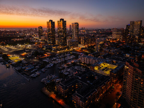 Marina and high-rise buildings in Jersey City at sunset
