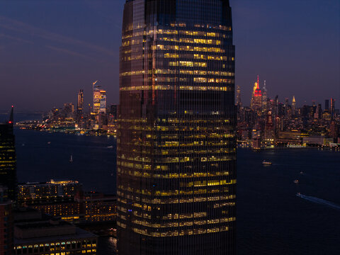 Skyscraper at Night with New York City Skyline