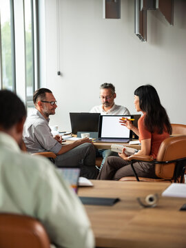 Collaborative Business Meeting With Colleagues Discussing 