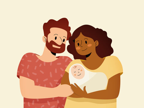 Interracial parents holding newborn baby celebrating family love