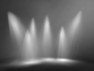 Bright white spotlights illuminating a dark stage with a smoky atmosphere creating dramatic lighting effects