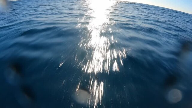 Bright sun glare reflecting intensely on deep blue ocean water surface with slight motion blur effect vector illustration