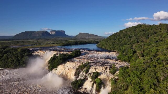 Backward Drone Flight Over the Red Waters and Tepui Landscape of Canaima Lagoon