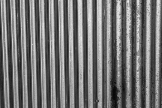 Industrial rusty background old grunge rusty zinc wall for textured background old rusty galvanized rust and scratched steel texture corrugated iron siding vintage background