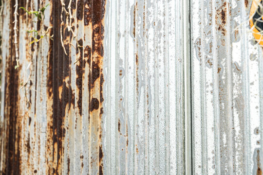 Industrial rusty background old grunge rusty zinc wall for textured background old rusty galvanized rust and scratched steel texture corrugated iron siding vintage background