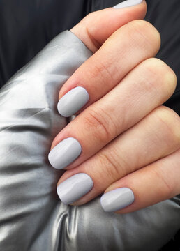 Grey color nails manicure closeup