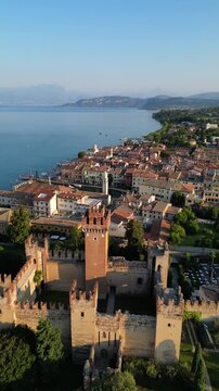 Scaliger Castle town of Lazise, Italy medieval fortification Lake Garda shore aerial drone