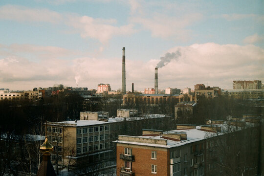 Factories Release Smoke in a Cityscape During Winter Afternoon