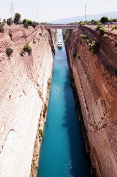 Boat Navigating Through the Corinth Canal in Greece on a Sunny Day