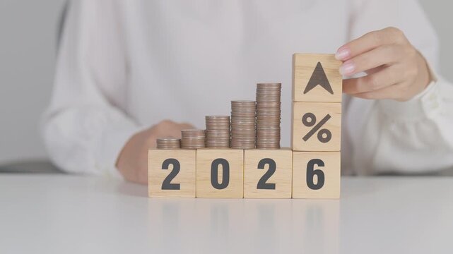 2026 New year with percentage change to UP and Down arrow with coin stack. Interest rate, GDP, stocks market, financial, deflation and Inflation, mortgage, debt, Loan and Economic Recession