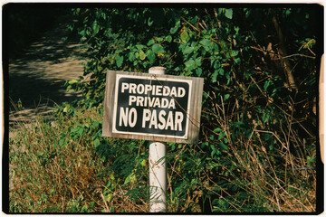 Analog image of a small sign warning that this is private property