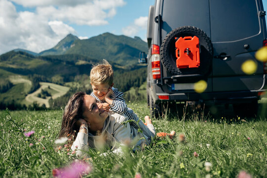 Family enjoying van life vacation in mountains