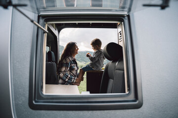 Mother and son enjoying van life family vacation