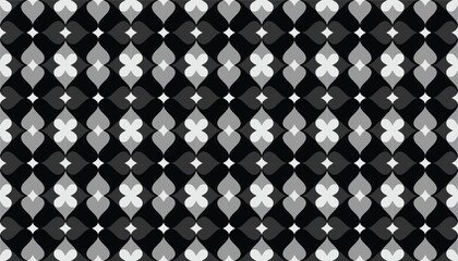 A seamless black-and-white geometric pattern featuring repeated petal-shaped motifs arranged in a tight grid. The alternating grayscale tones create a rhythmic visual flow