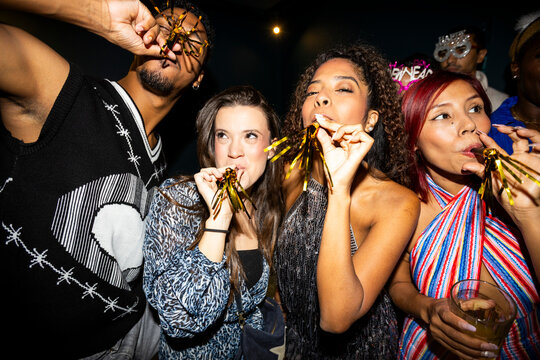 Diverse group of friends celebrating at new years party