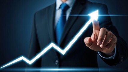 Businessman's hand touching glowing upward arrow chart, symbolizing growth.