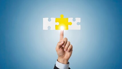 Business hand pointing at a glowing yellow jigsaw puzzle piece, finding solution