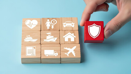 Hand places red shield block on insurance types, representing full coverage