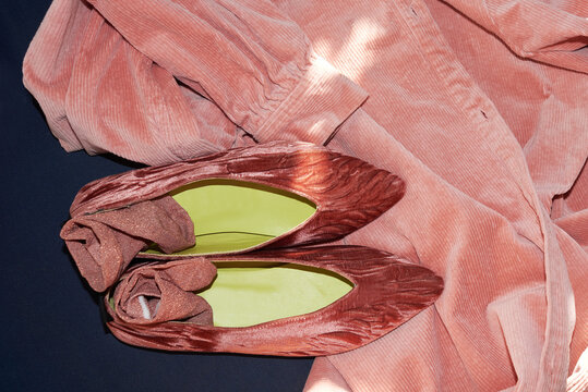 Pink flat shoe pared with pink dress