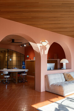 Cozy living room with couch and meeting room with desk