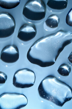 Water Droplets on a Blue Background Creatine a Natural Beauty Pattern