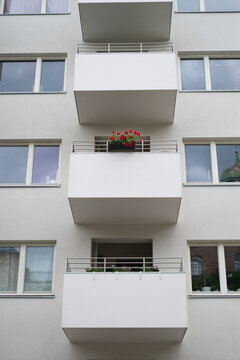 Modern Balcony With Flowers on a Building Facade