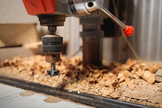 Drill Press and Wood Shavings in Workshop