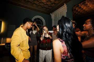 Young people enjoying live music performance at party