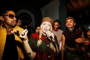 Female singer performing live music with friends