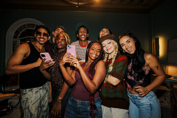 Diverse friends capturing moment and sharing happiness with selfie