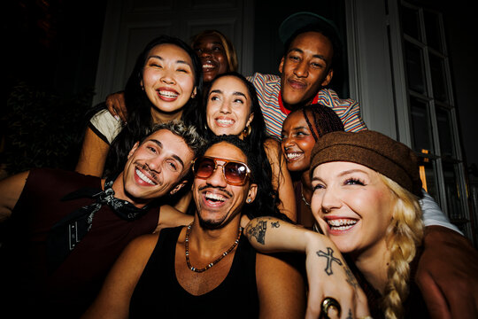 Diverse friends enjoying live music during night party