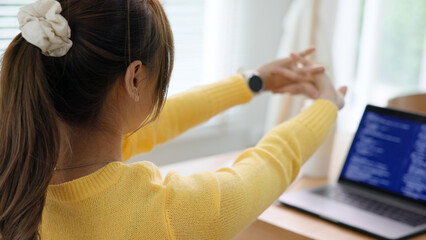 Gen Z workforce work hybrid workplace. Young adult asia people sit learn from online study class at home digital nomad stretch arm stiff neck pain yoga self care body relax stress relief break time.