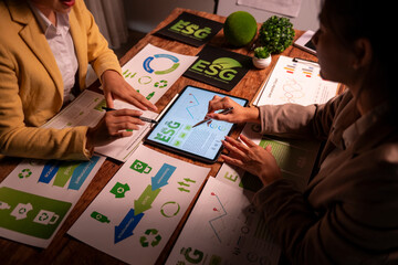 Businesswomen discussing esg strategy and sustainability reporting