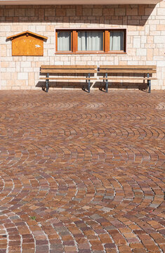 Wooden Benches on Herringbone Brick Pavement