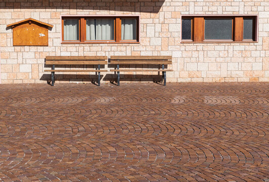 Wooden Benches on Herringbone Brick Pavement