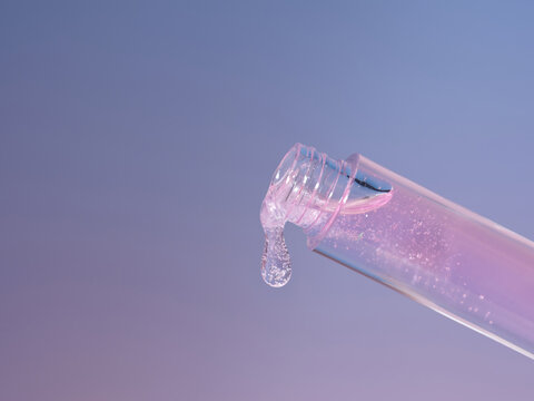 Cosmetic product pouring out of a tube against a gradient background